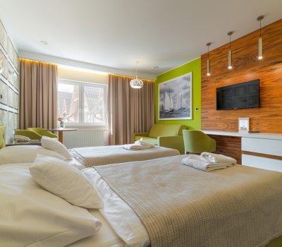 Odpocznij |w Komfortowych pokojach i apartamentach